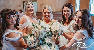 Cheri and her Bridesmaids showing off their bouquets in the Mt. Olive Baptist Church in Florence, MO. (Photo Credit: Amber Koelling Photography)