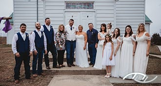 John & Cheri with her Parents and their Wedding Party in front of Mt. Olive Baptist Church in Florence, MO. (Photo Credit: Amber Koelling Photography)