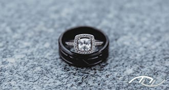 John & Cheri's rings on a granite counter top at the Stover Community Center in Stover, MO. (Photo Credit: Amber Koelling Photography)